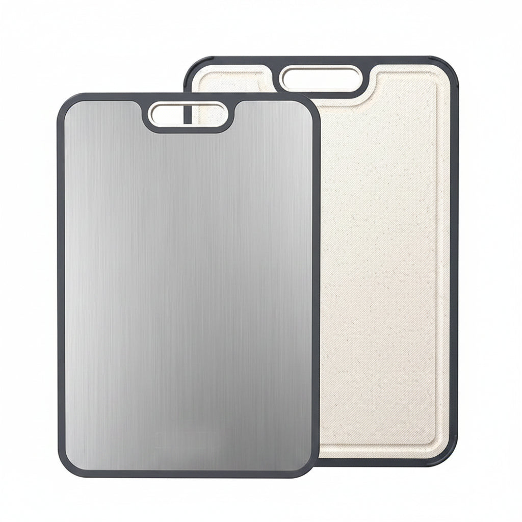 Two cutting boards, one metallic and one textured, with a basket of fruits on a white background.